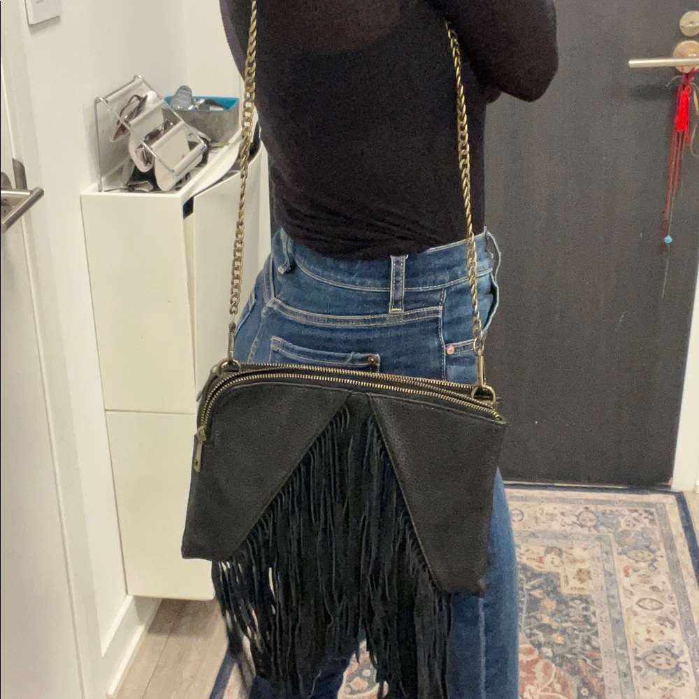 Leather crossbody bag with fringes.